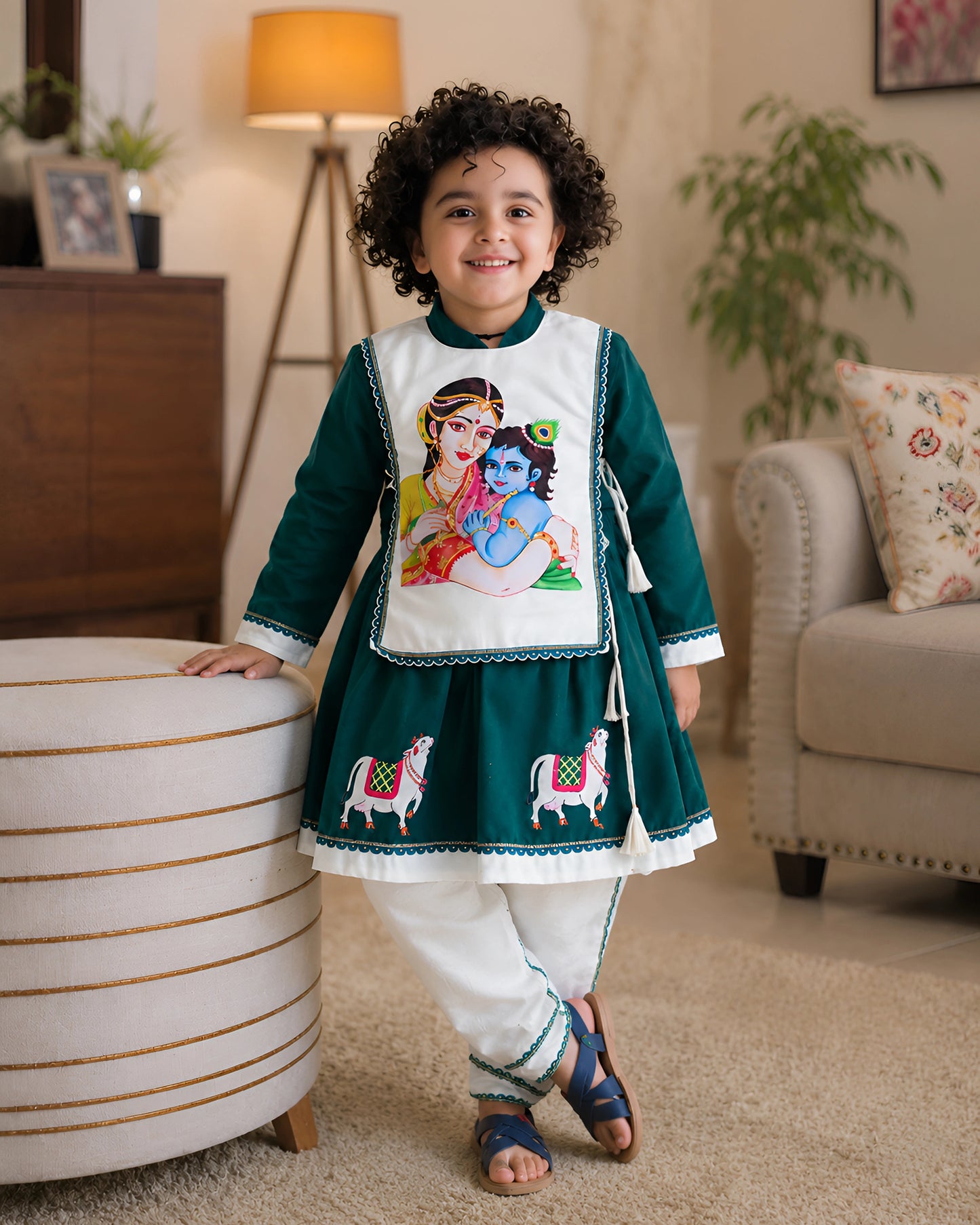 Child wearing a traditional outfit with a colorful design in a living room setting
