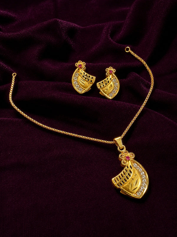 Gold jewelry set featuring a pendant necklace and matching earrings with small red floral accents and clear stones, displayed on a dark purple velvet fabric background.