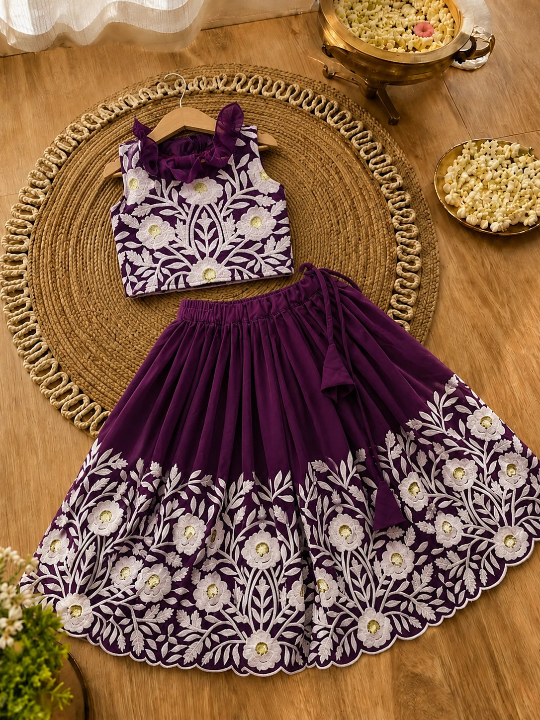 Children's outfit with top and skirt on a wooden surface