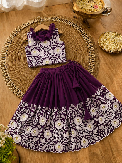 Children's outfit with top and skirt on a wooden surface