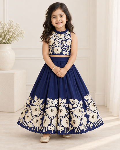 Girl smiling in royal blue embroidered lehenga set