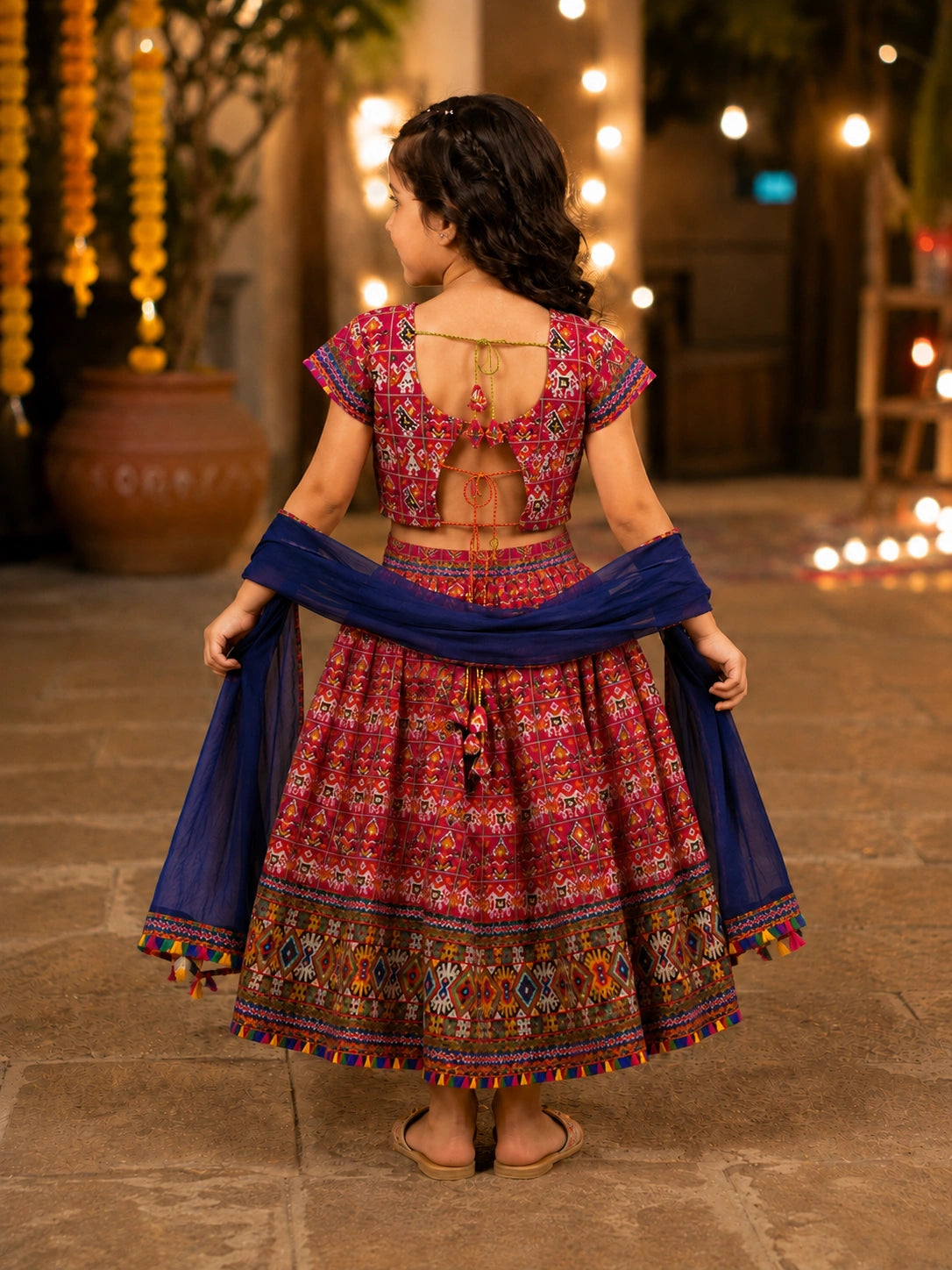 Maroon Kaju Katri Patola Lehenga Choli - Girl Twirling at Festive Night