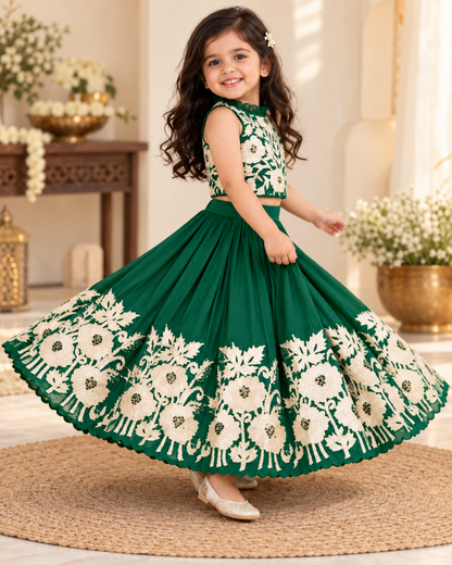 Girl in royal green embroidered lehenga set, standing front view
