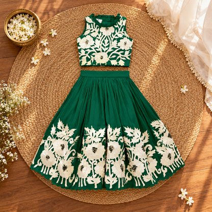 Girl in royal green embroidered lehenga set, back view