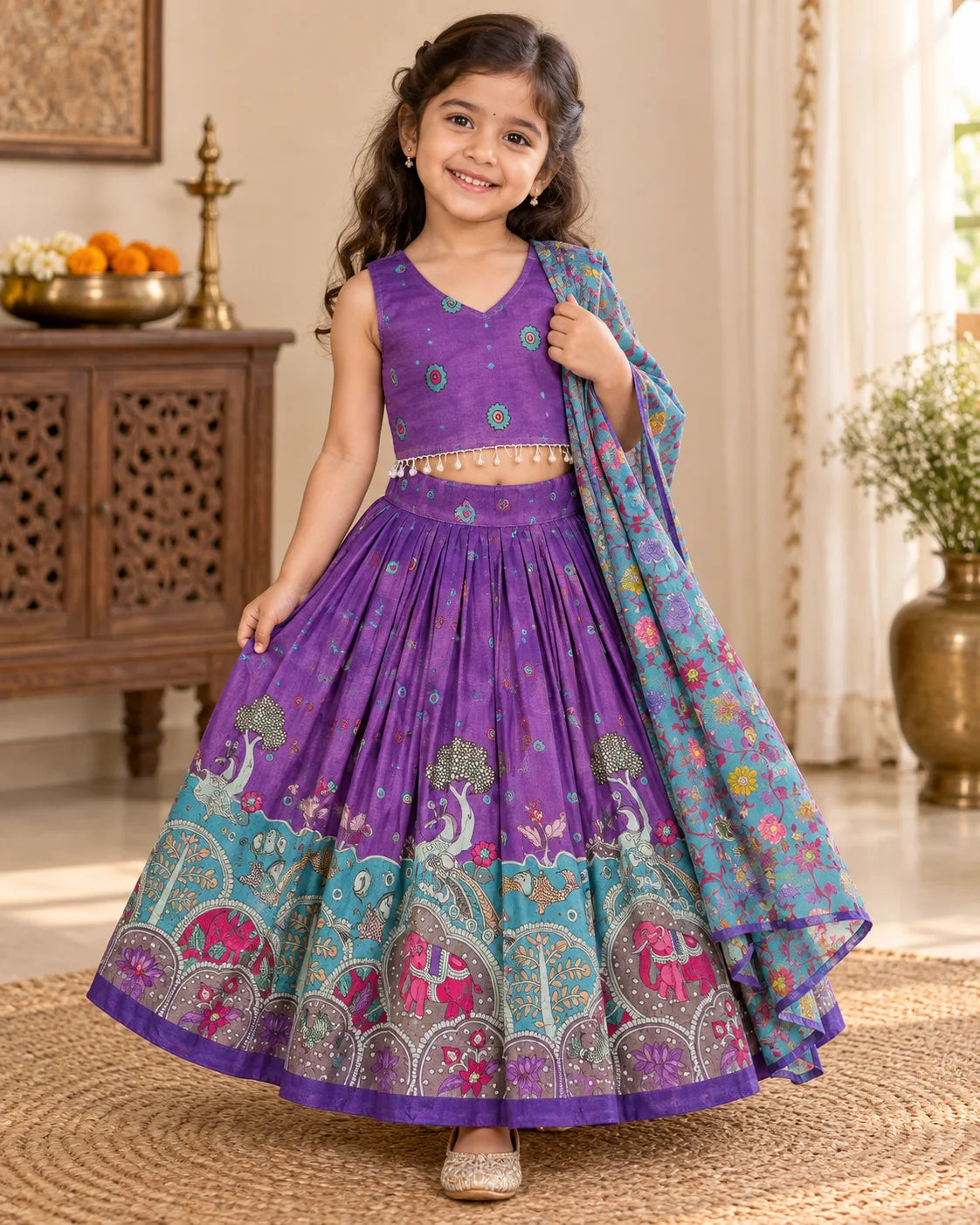 Girl wearing a purple and turquoise printed lehenga choli set with dupatta
