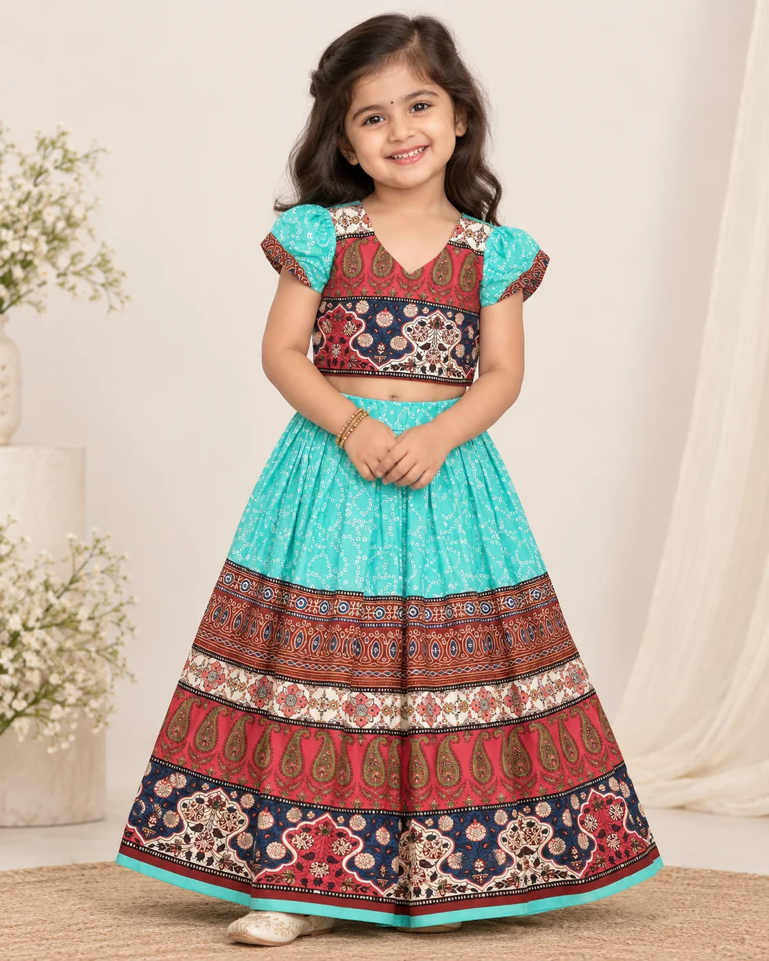 Turquoise and maroon girls lehenga choli set displayed flat with dupatta