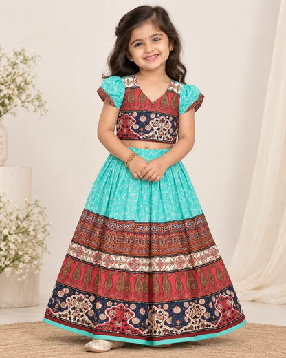 Turquoise and maroon girls lehenga choli set displayed flat with dupatta
