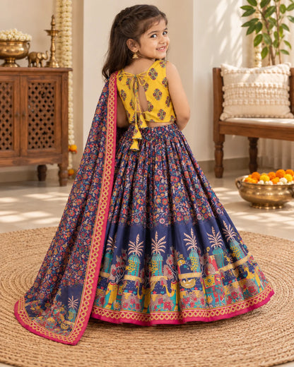 Girl wearing a yellow and navy printed lehenga choli set with dupatta