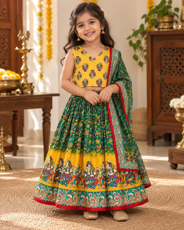 Girl wearing a festive yellow and green lehenga choli set
