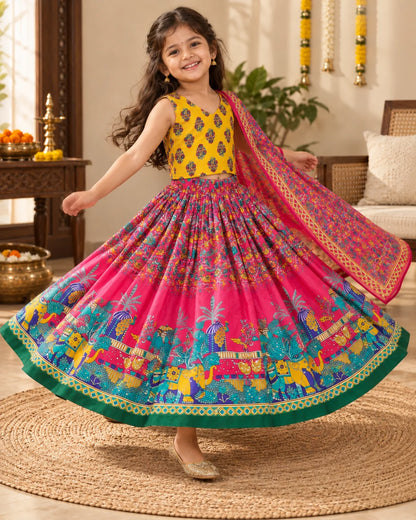 Pink and yellow printed girls lehenga choli set displayed flat