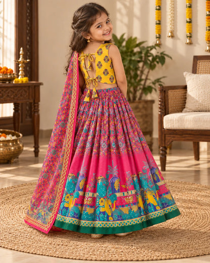 Girl wearing a pink and yellow printed lehenga choli set with dupatta